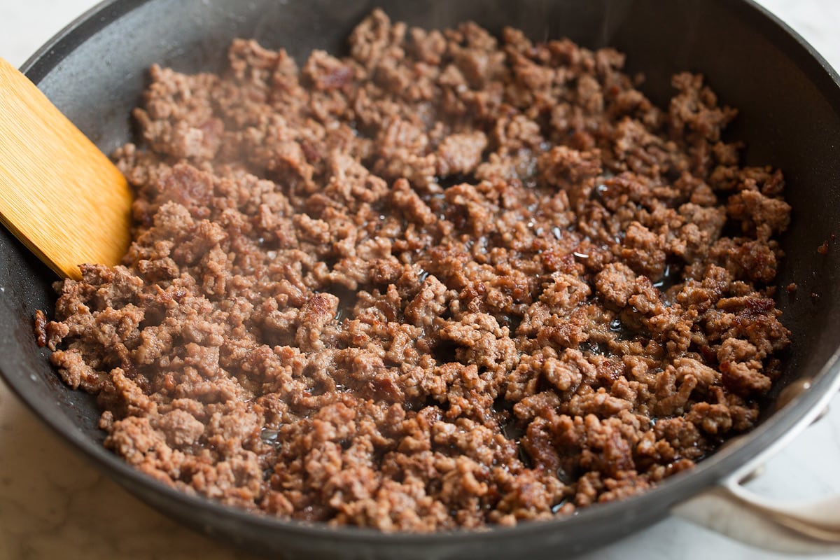 Ground beef in skillet after crumbled and cooked.