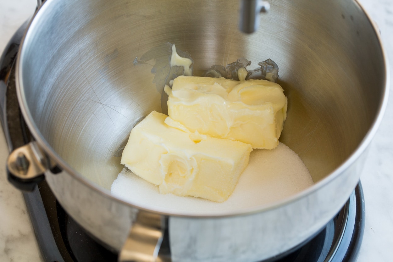 Showing how to make butter cookies in a stand mixer. Starting by mixing butter and sugar.