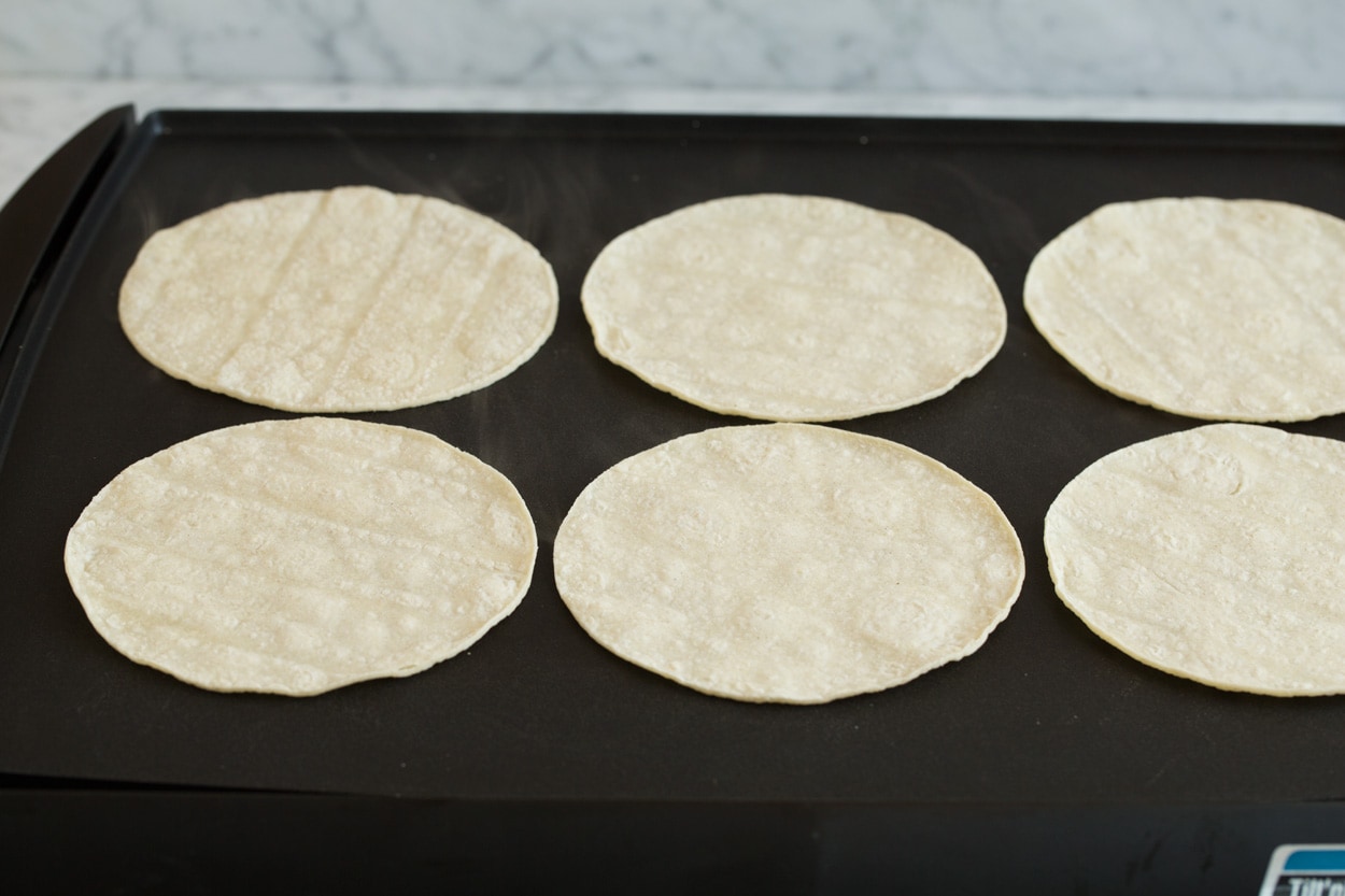 Heating tortillas on griddle to make pliable for enchiladas