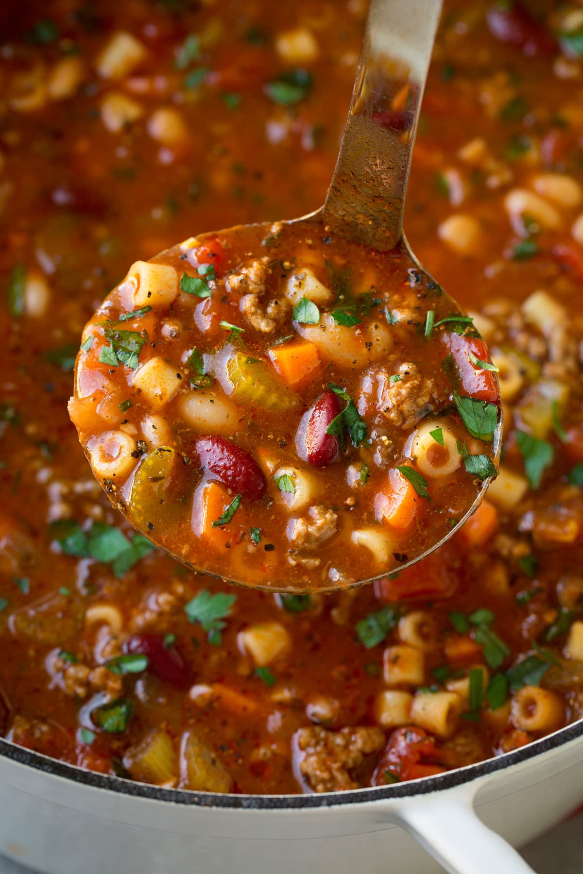 Ladle full of copycat olive garden pasta fagioli soup.
