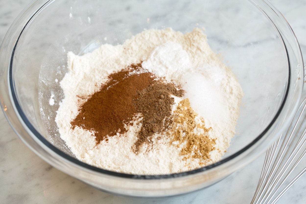 Pumpkin muffins shown here whisking dry ingredients together in mixing bowl