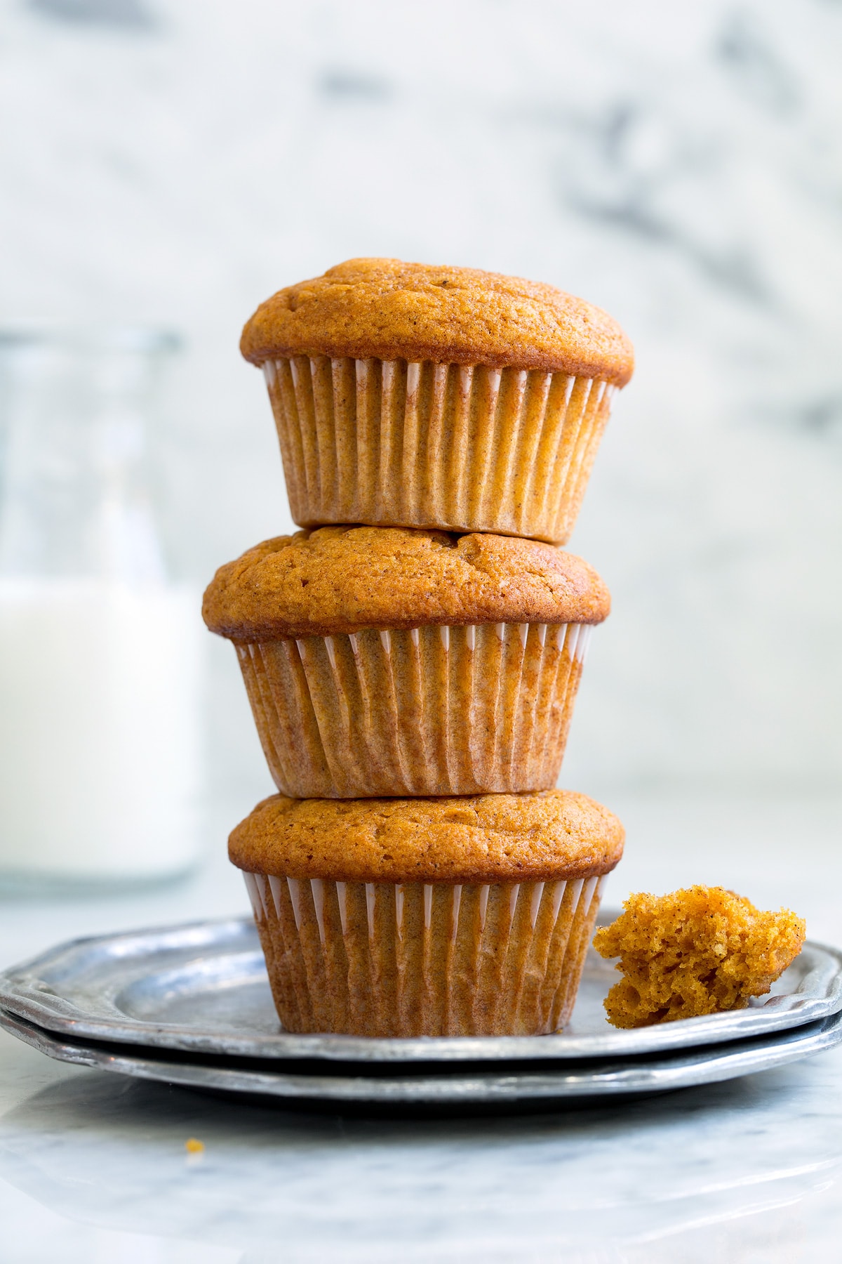 Stack of Pumpkin Muffins on a small pewter plate