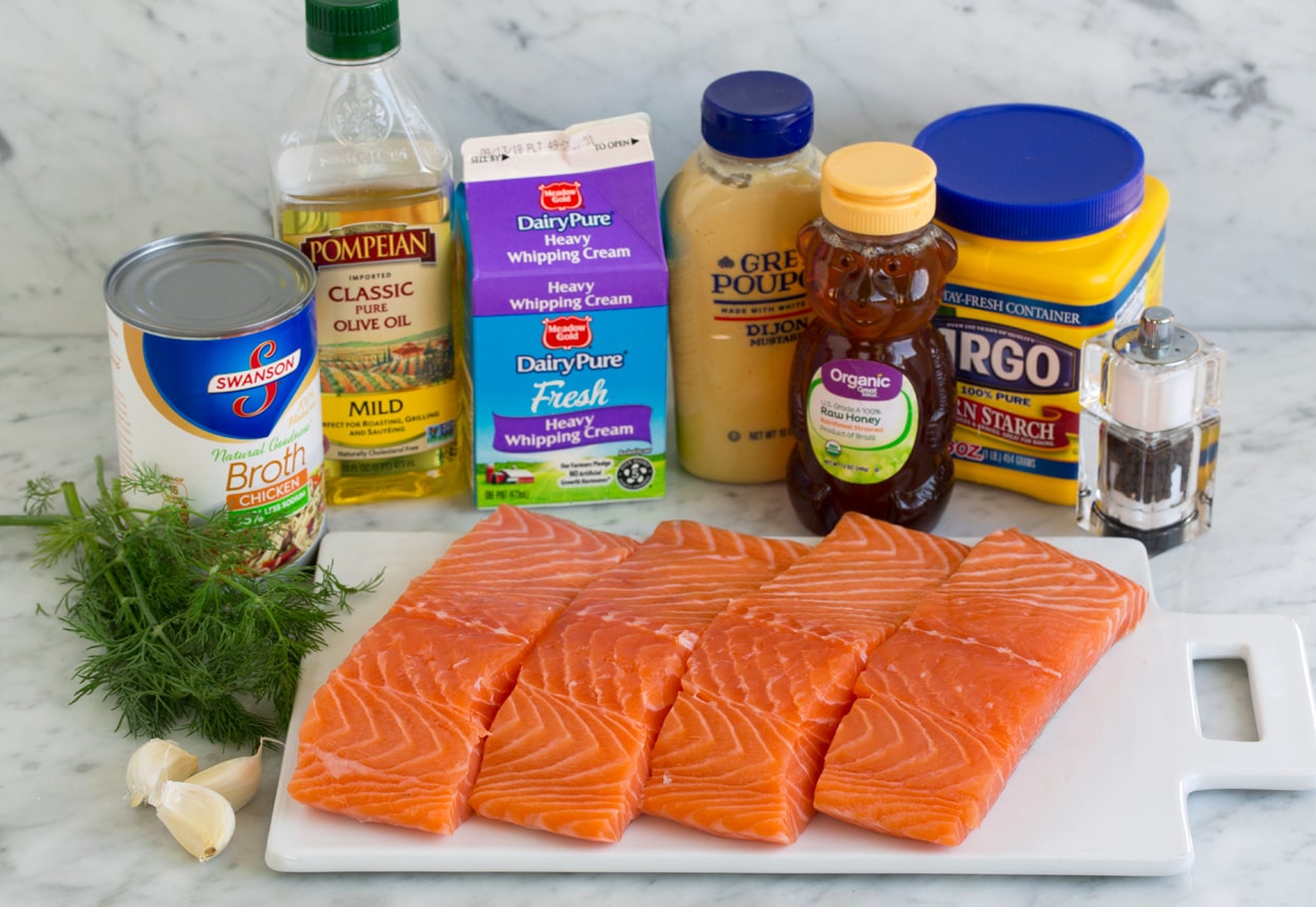 Ingredients for salmon shown here. Salmon fillets, garlic, dill, chicken broth, olive oil, cream, dijon, honey and cornstarch.