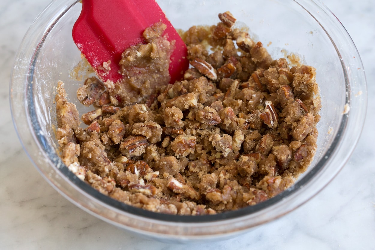 Sweet potato casserole pecan topping in mixing bowl.