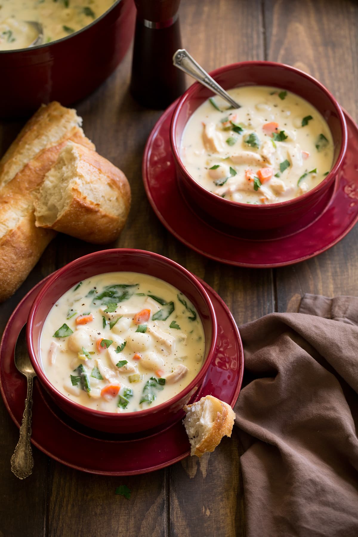 Two servings of creamy chicken gnocchi soup.