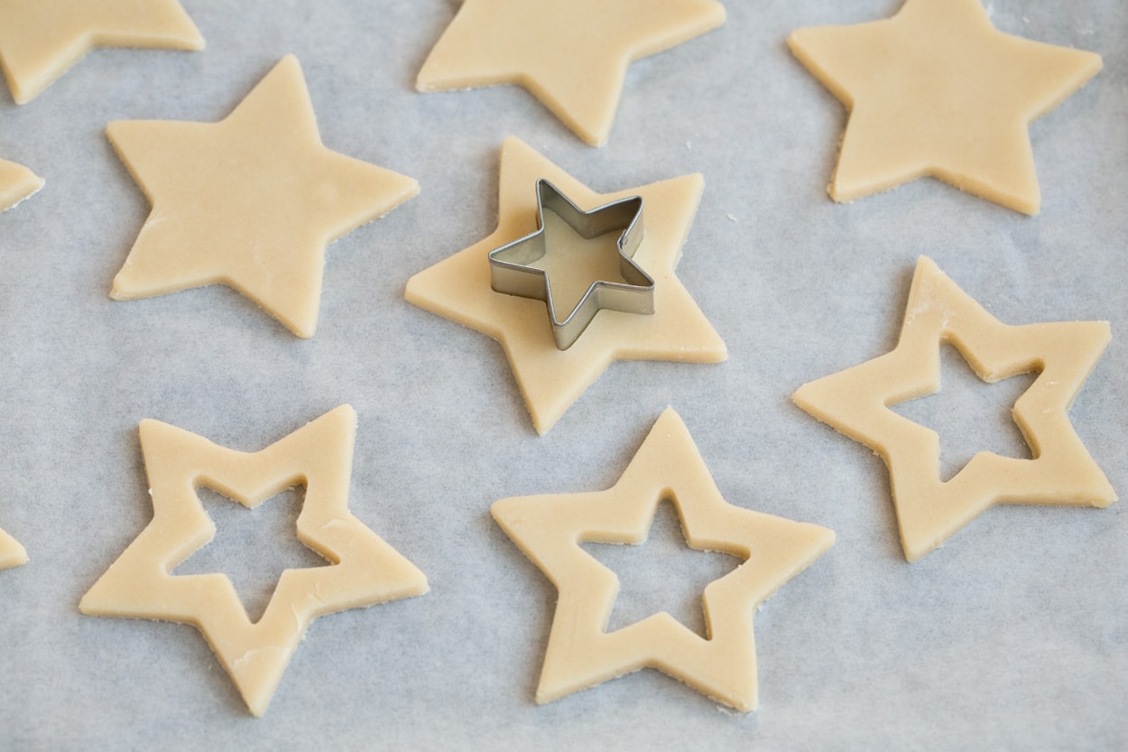 Cutting center portion from cookies with a small star cookie cutter.