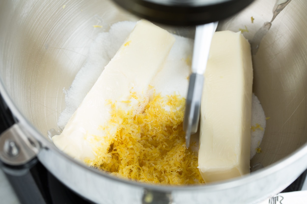 Showing how to make lemon shortbread cookies. Mixing butter, lemon zest and sugar in stand mixer.