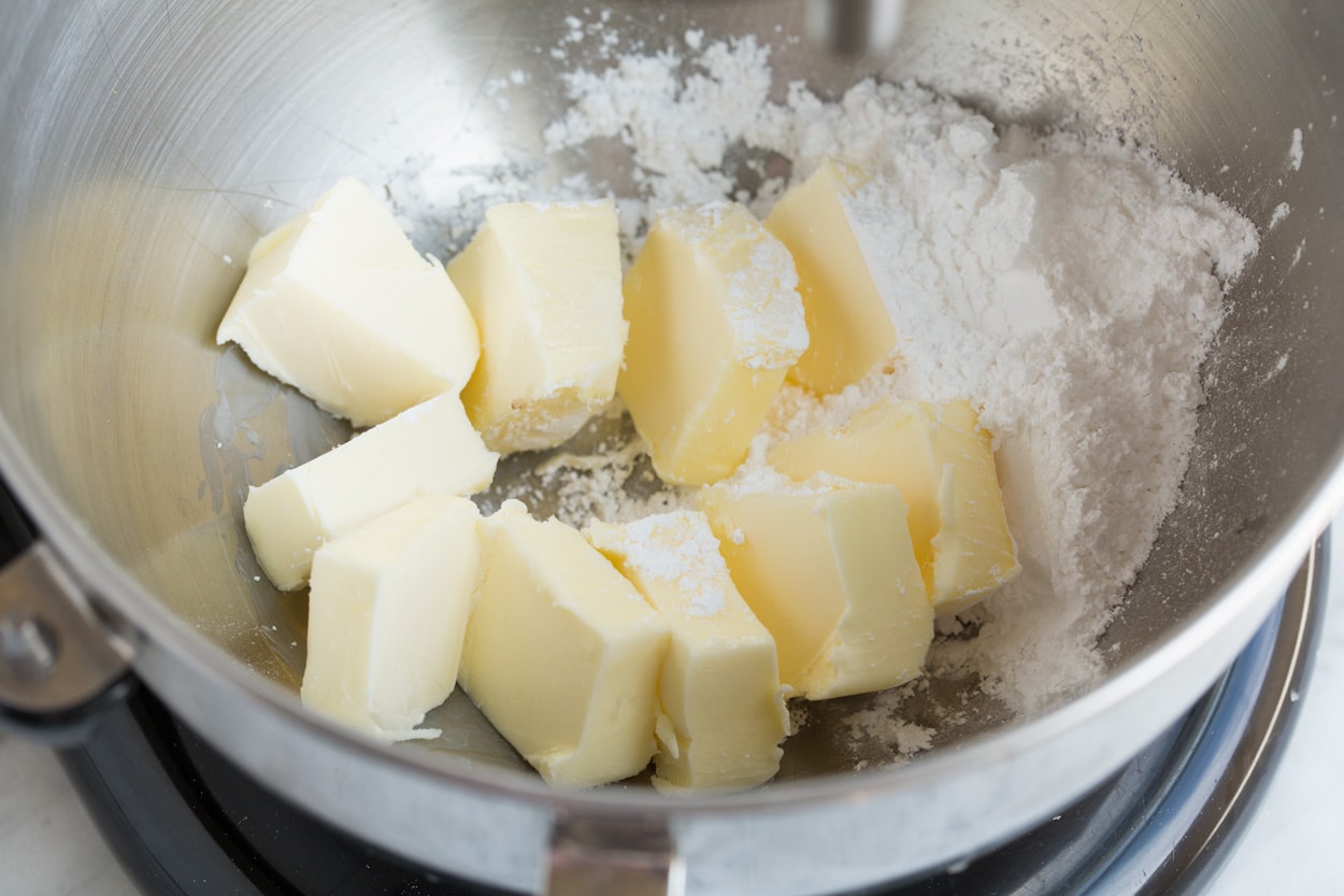 Mixing butter and powdered sugar in stand mixer bowl for Mexican Wedding Cookies
