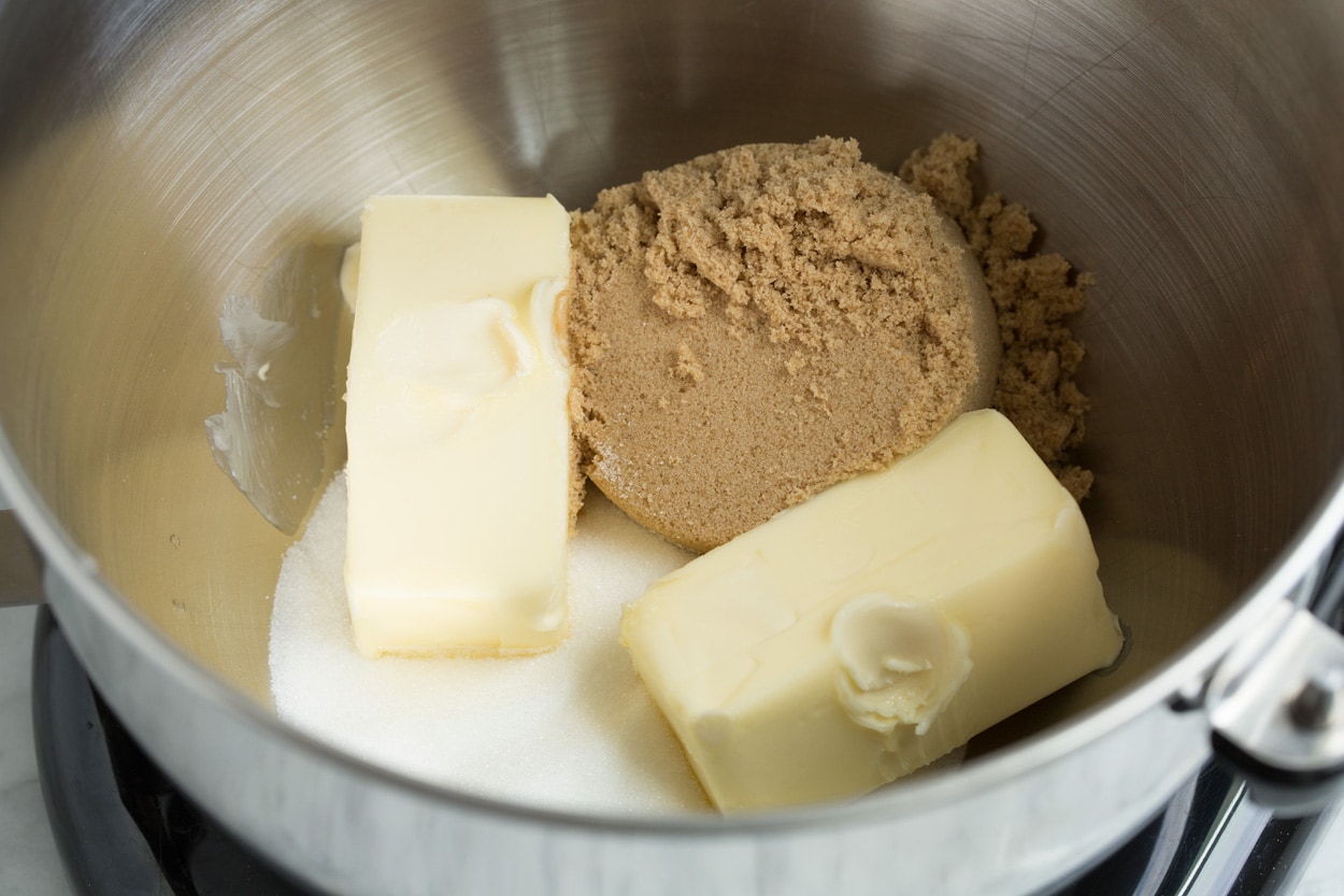 Mixing butter and sugars in a stand mixer to make oatmeal cookies.