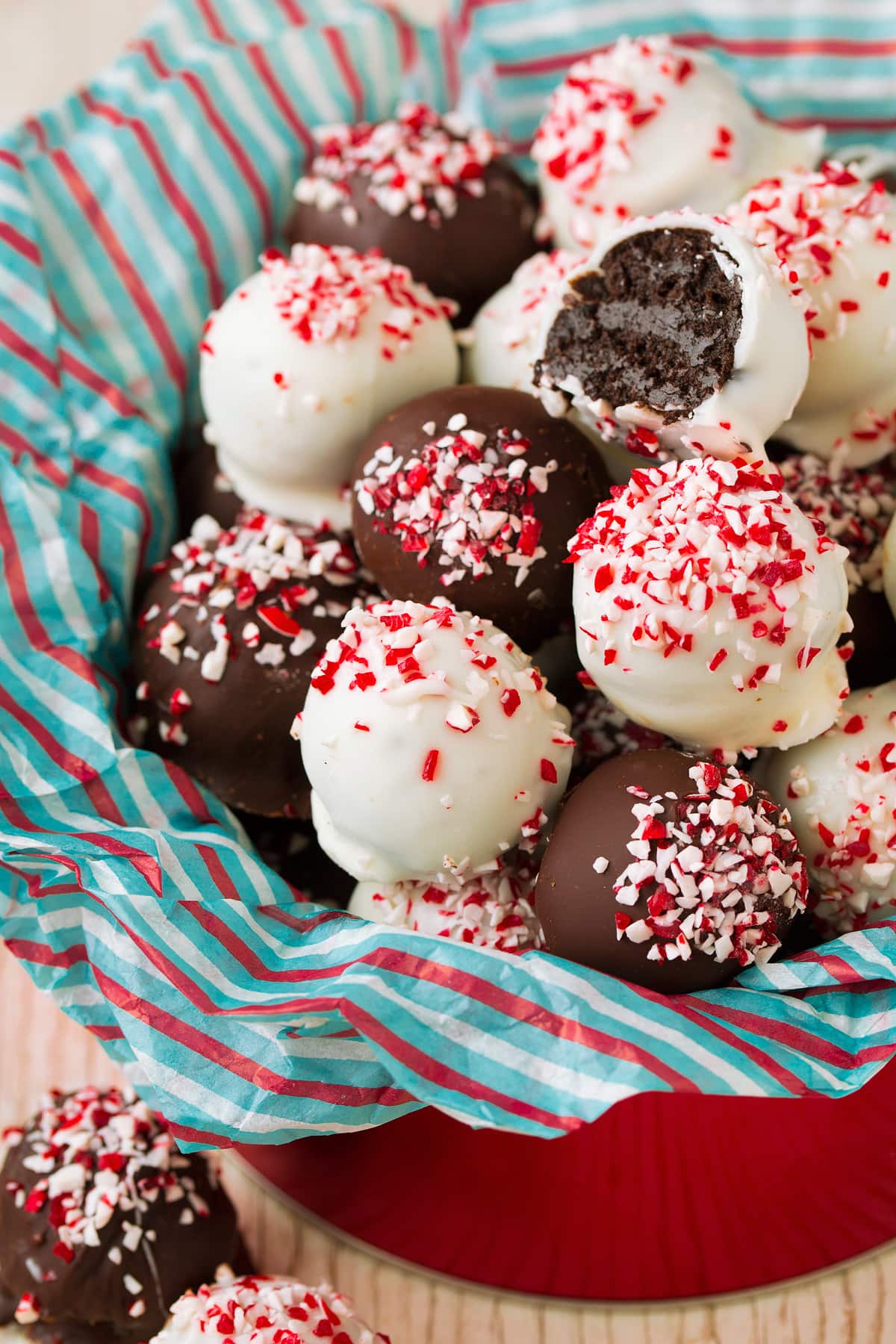 Peppermint Oreo Truffles in a metal Christmas tin.