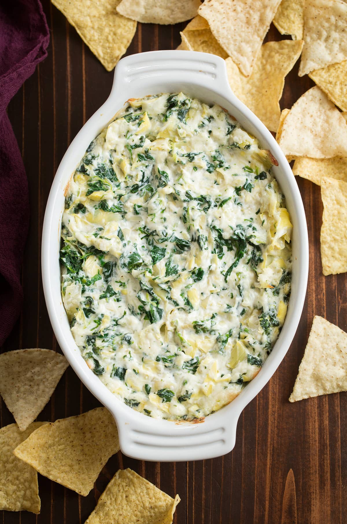 Spinach Artichoke Dip in a small white baking dish.
