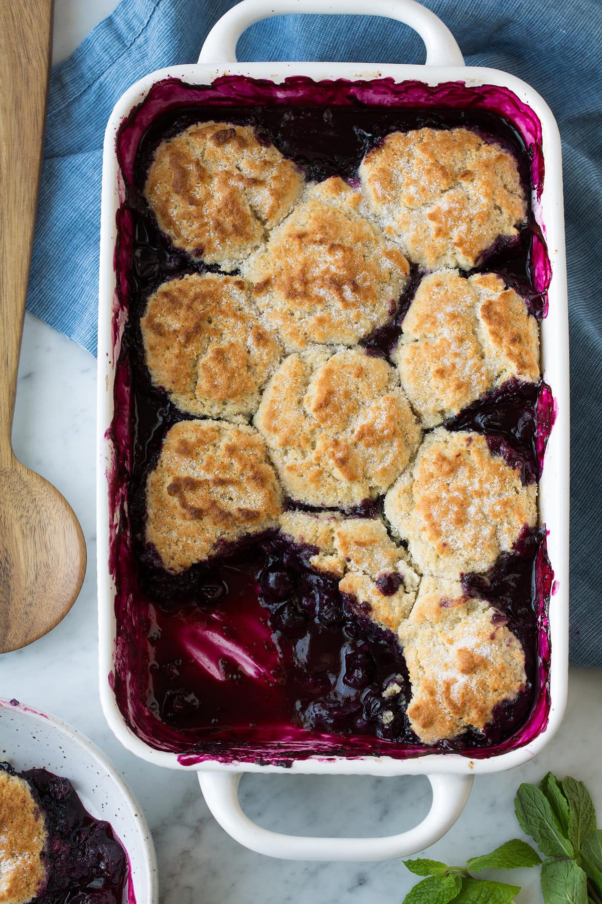 Blueberry Cobbler in white baking dish