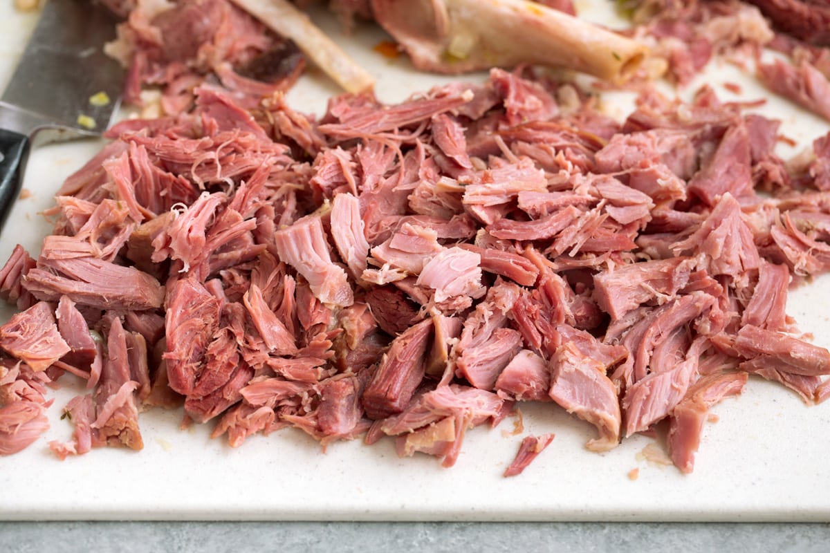 Ham and Bean Soup Shredded ham on a cutting board.