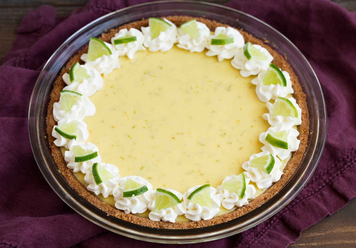 Whole key lime pie after baking, chilling and decorating.