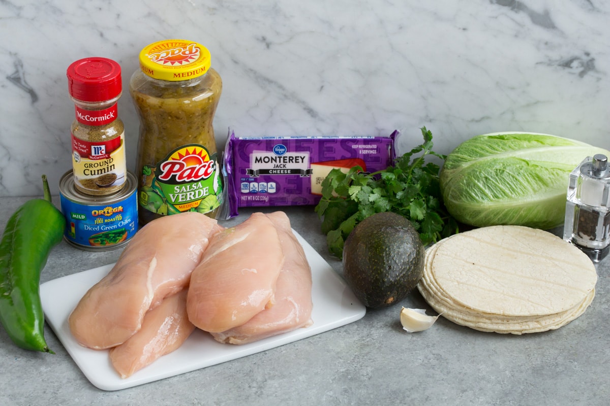 Salsa Verde Chicken (Slow Cooker or Instant Pot) - perfect for tacos, burritos, tostadas and more! Ingredients needed to make Salsa Verde Chicken and tacos shown here.