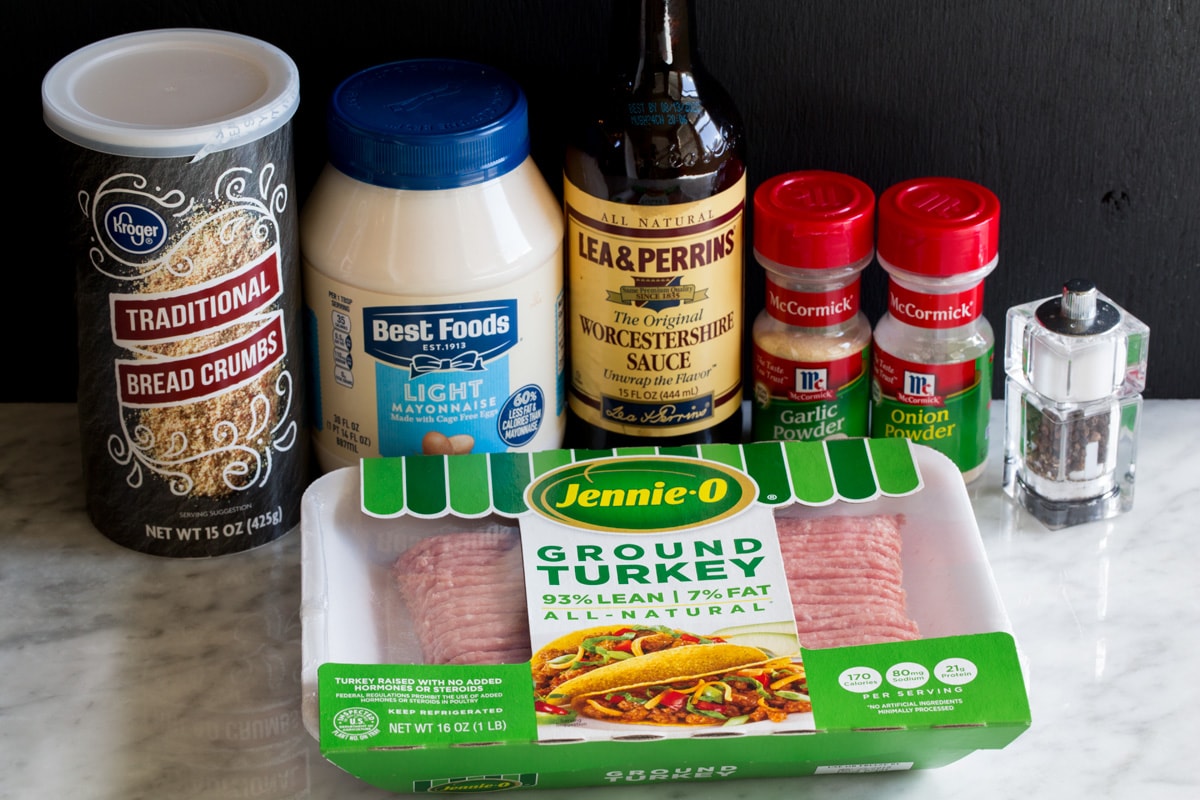 Ingredients needed to make turkey burgers shown here, including ground turkey, bread crumbs, light mayonnaise, Worcestershire, garlic powder onion powder, salt and pepper. 