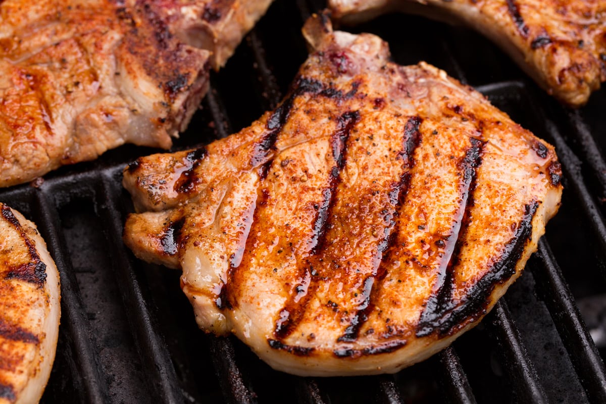 Grilled Pork Chops Close up image of pork chop on grill.