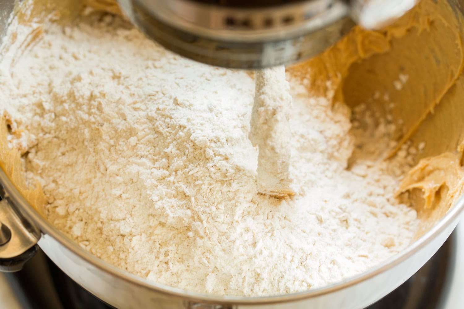 Flour and oat mixture added to cookie bar mixture.