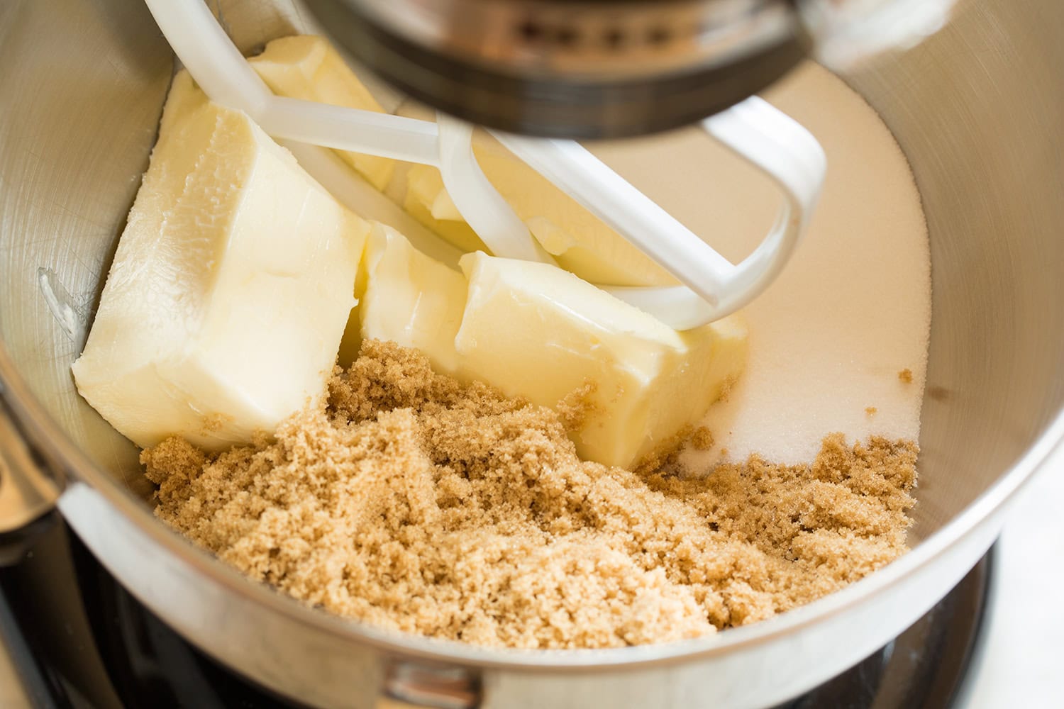 Creaming butter, brown sugar and white sugar in a stand mixer.