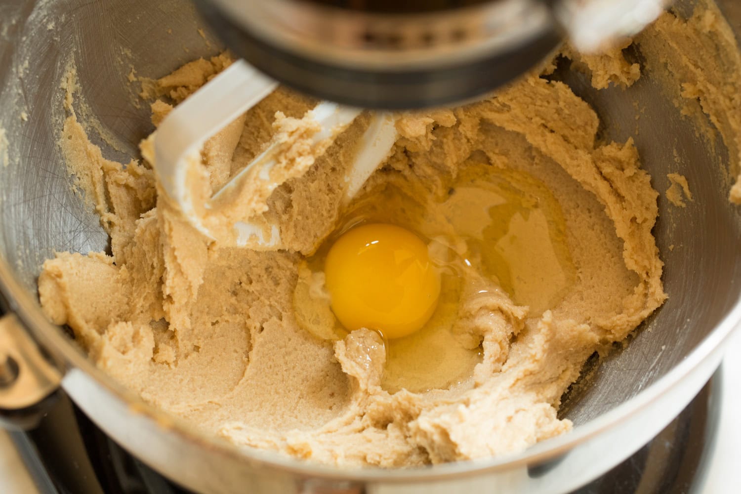 Eggs added to cookie dough mixture.