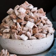 Bowl mounded full of puppy chow muddy buddies.