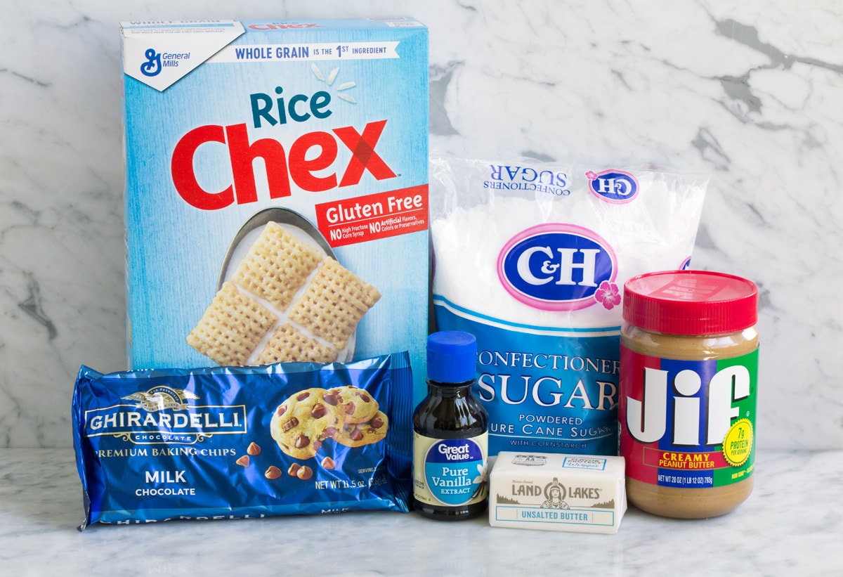 Perfect Puppy Chow {Muddy Buddies}! - one of my go-to treats! These are dangerously addictive! Perfect for parties, holidays and traveling too. #muddybuddies #puppychow #treat #chocolate #chex #peanutbutter Ingredients needed to make puppy chow including chex cereal, powdered sugar, chocolate chips, peanut butter, vanilla and butter.