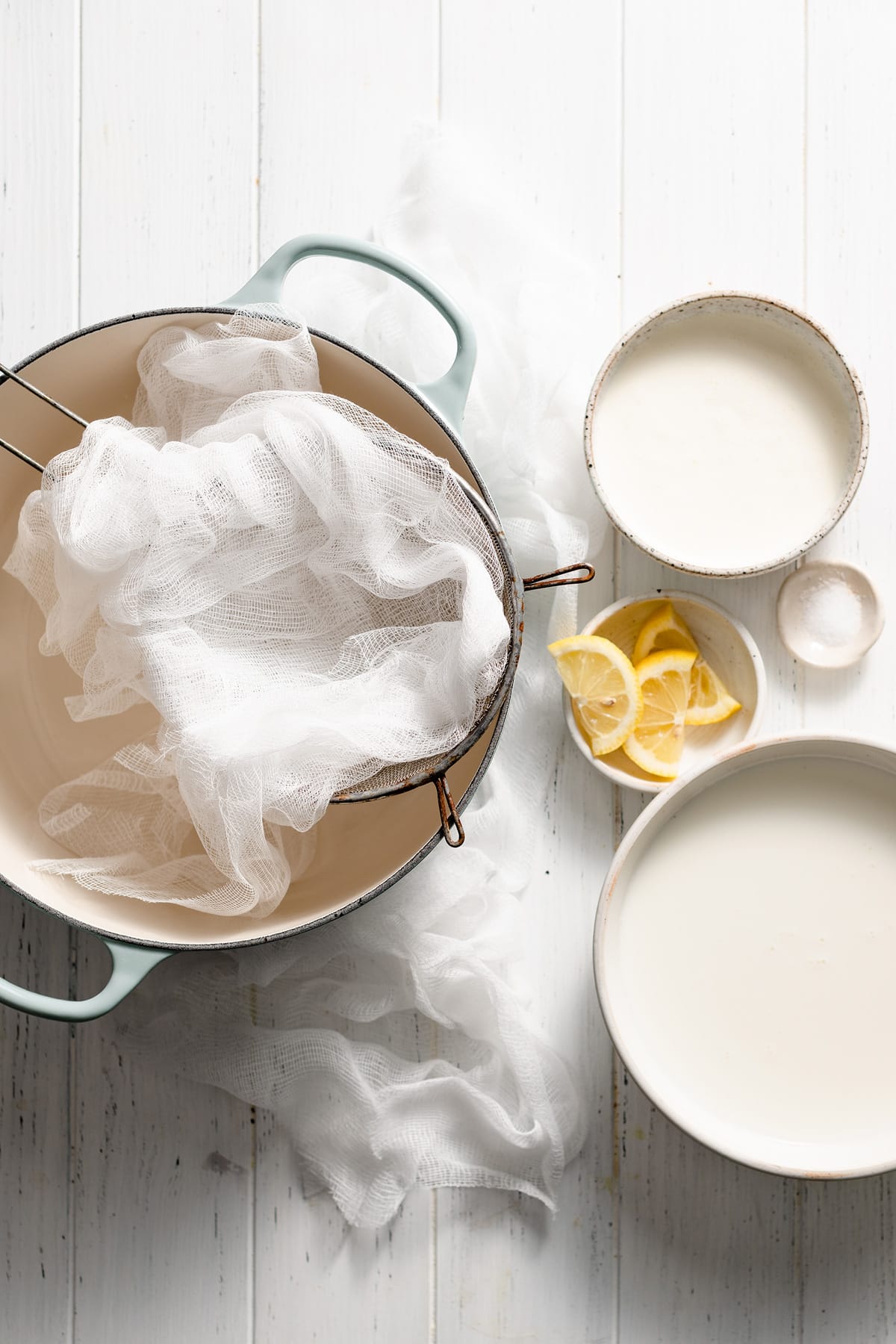 Ingredients and equipment needed to make ricotta cheese shown here.