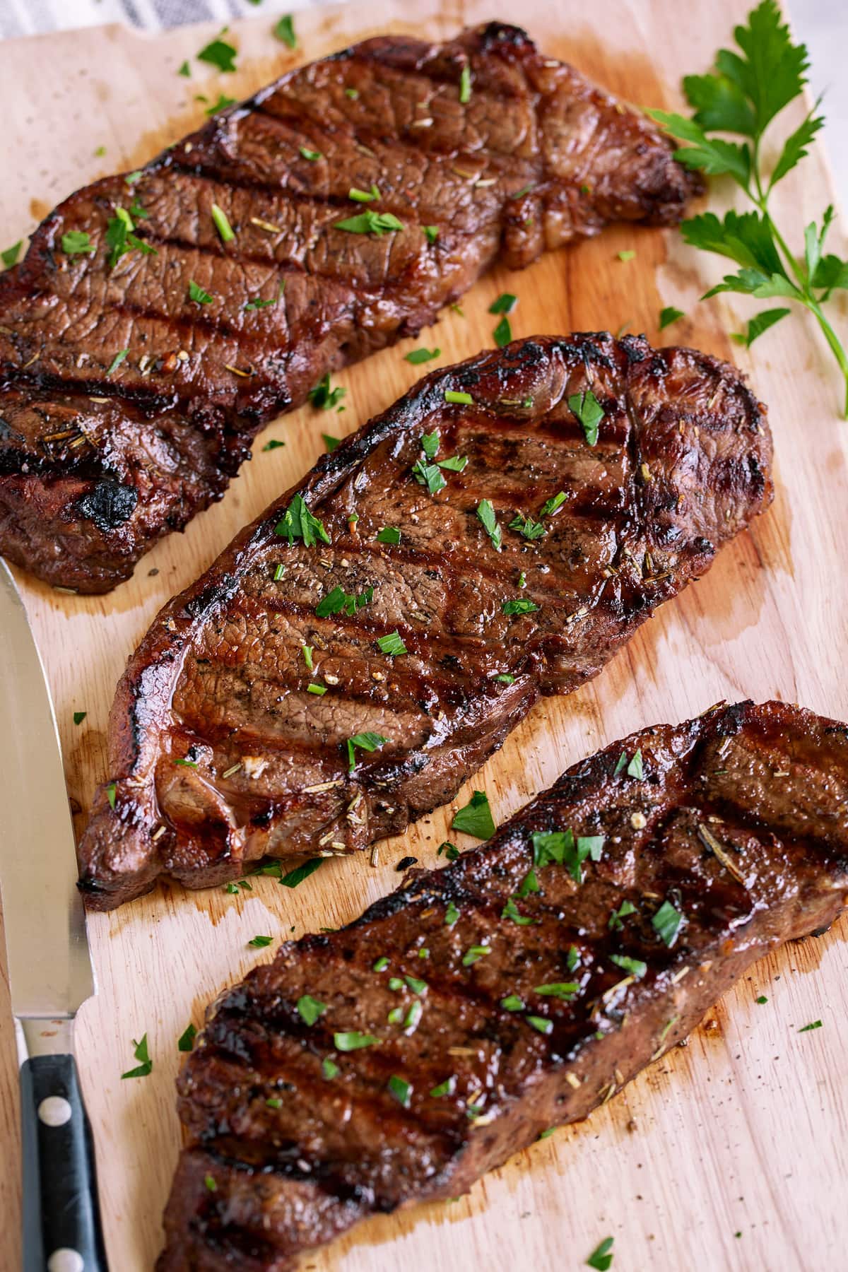 Three marinated grilled steaks.