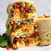 Stack of breakfast burritos.