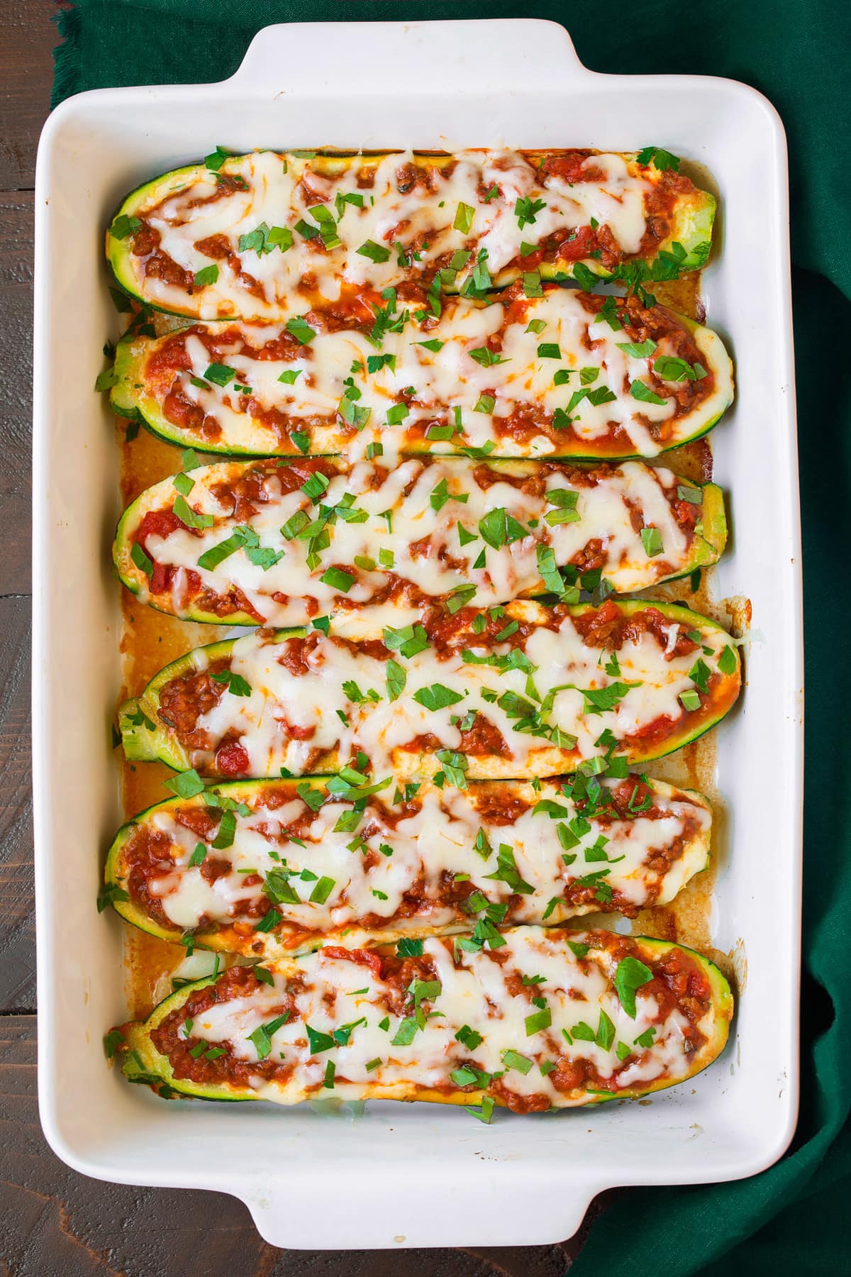 lasagana stuffed zucchini boats in baking dish after baking