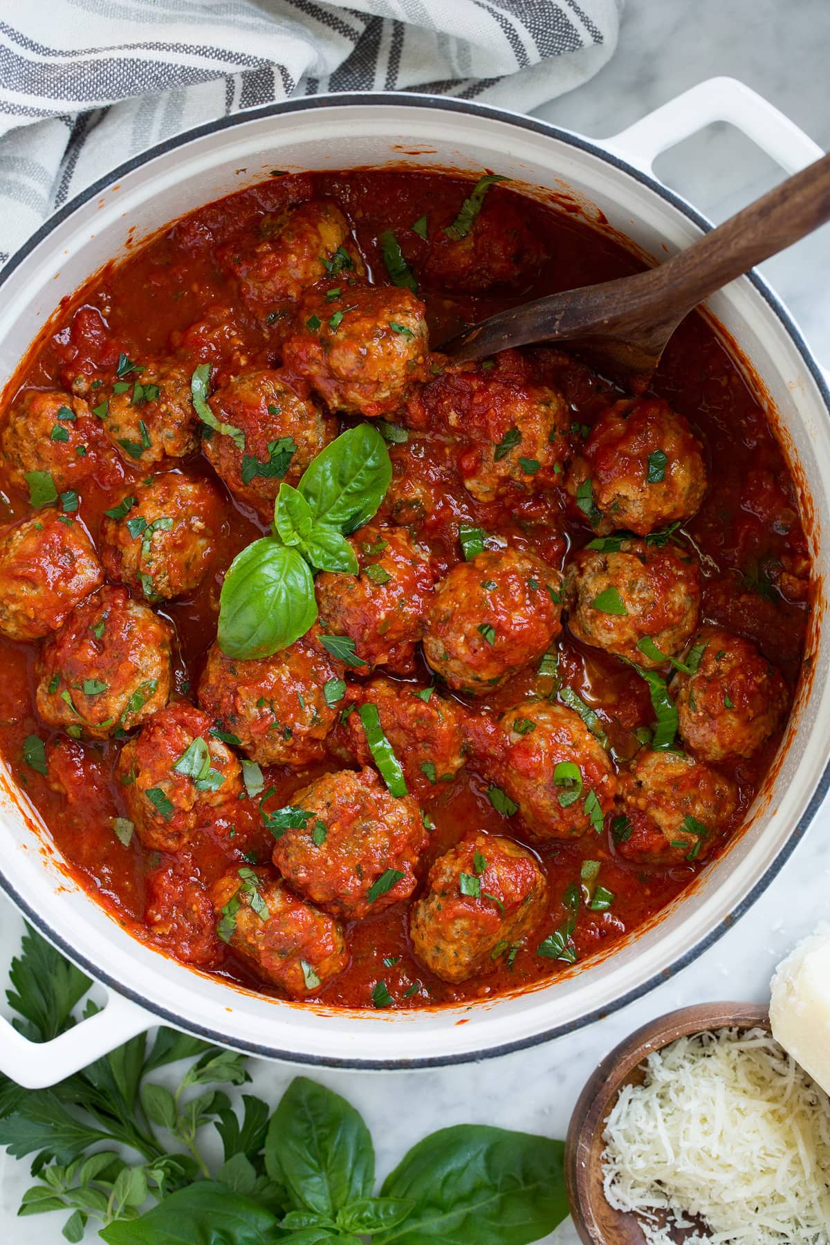 Pot full of meatballs and marinara sauce.