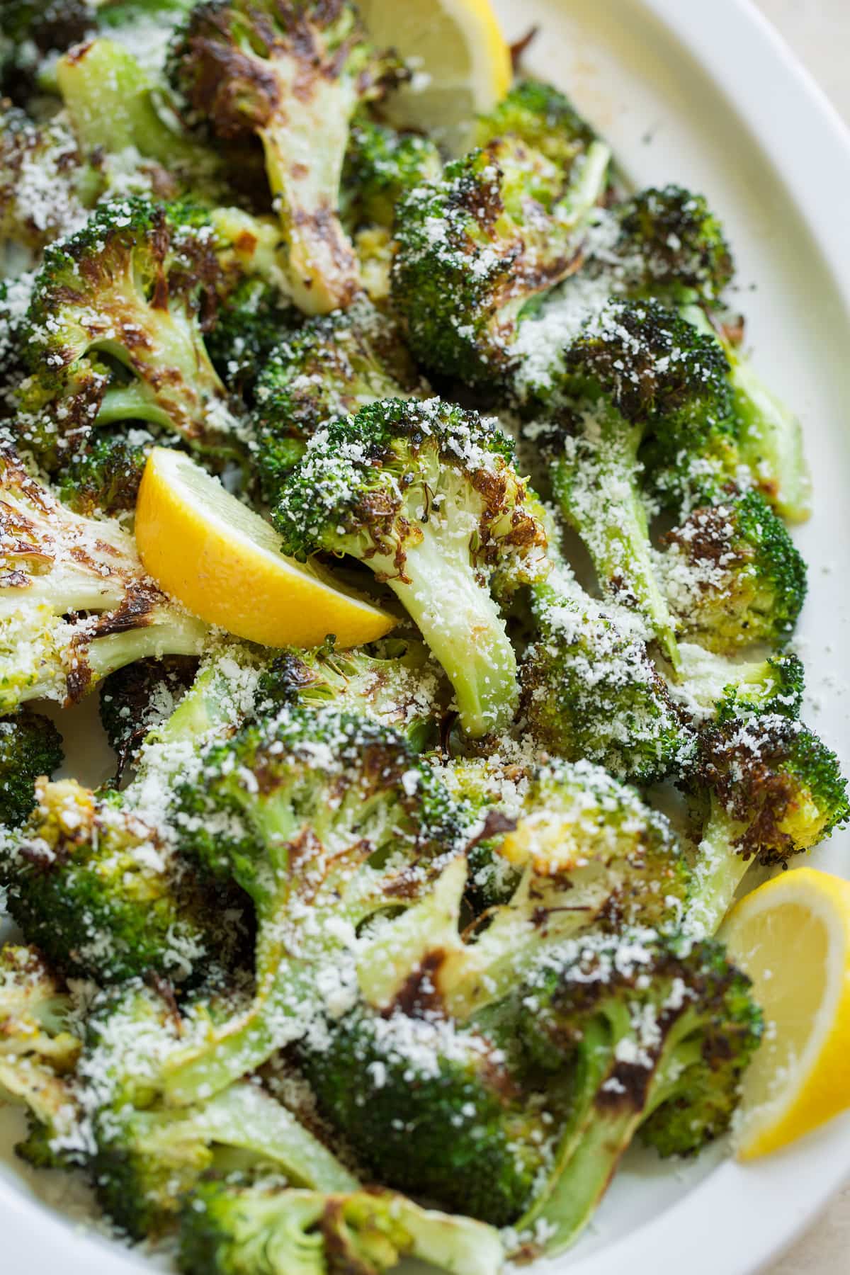 perfectly tender, deliciously browned and incredibly flavor. Broccoli goes from drab and bland to perfectly flavorful with this simple method. The best way to cook broccoli! Roasted broccoli with parmesan and lemon served over top.