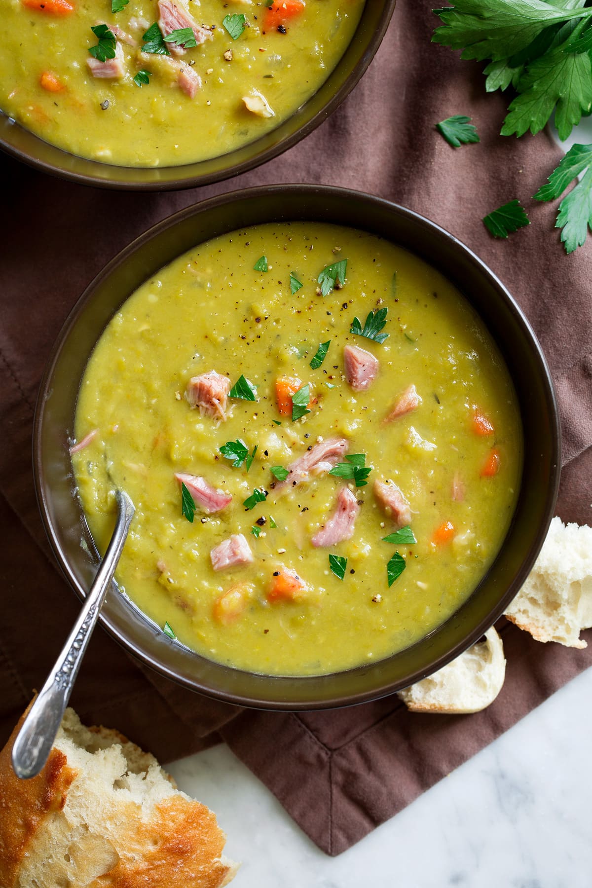 Overhead image of two bowls of made from scratch split pea soup.