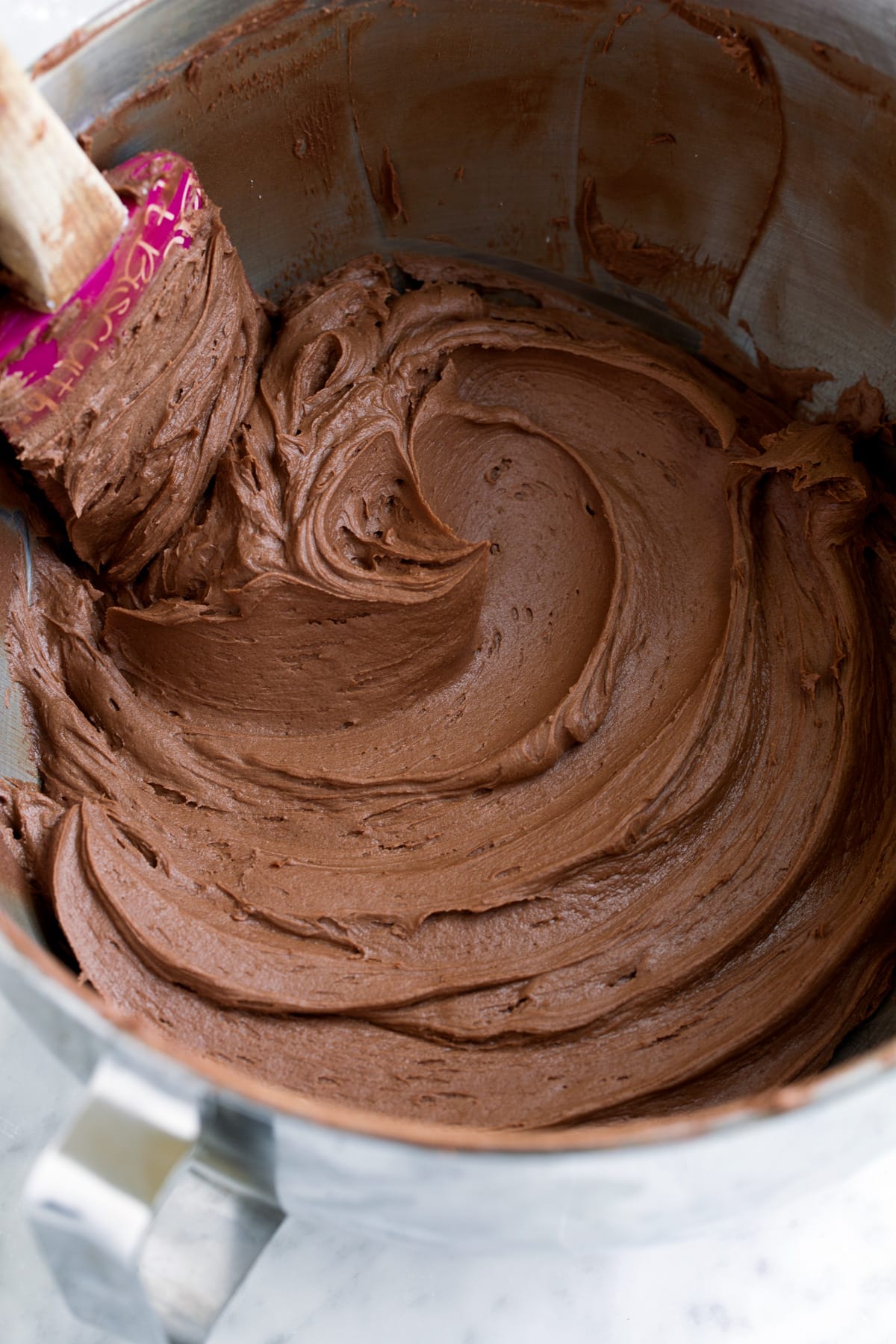 Chocolate Buttercream Frosting in a mixing bowl.