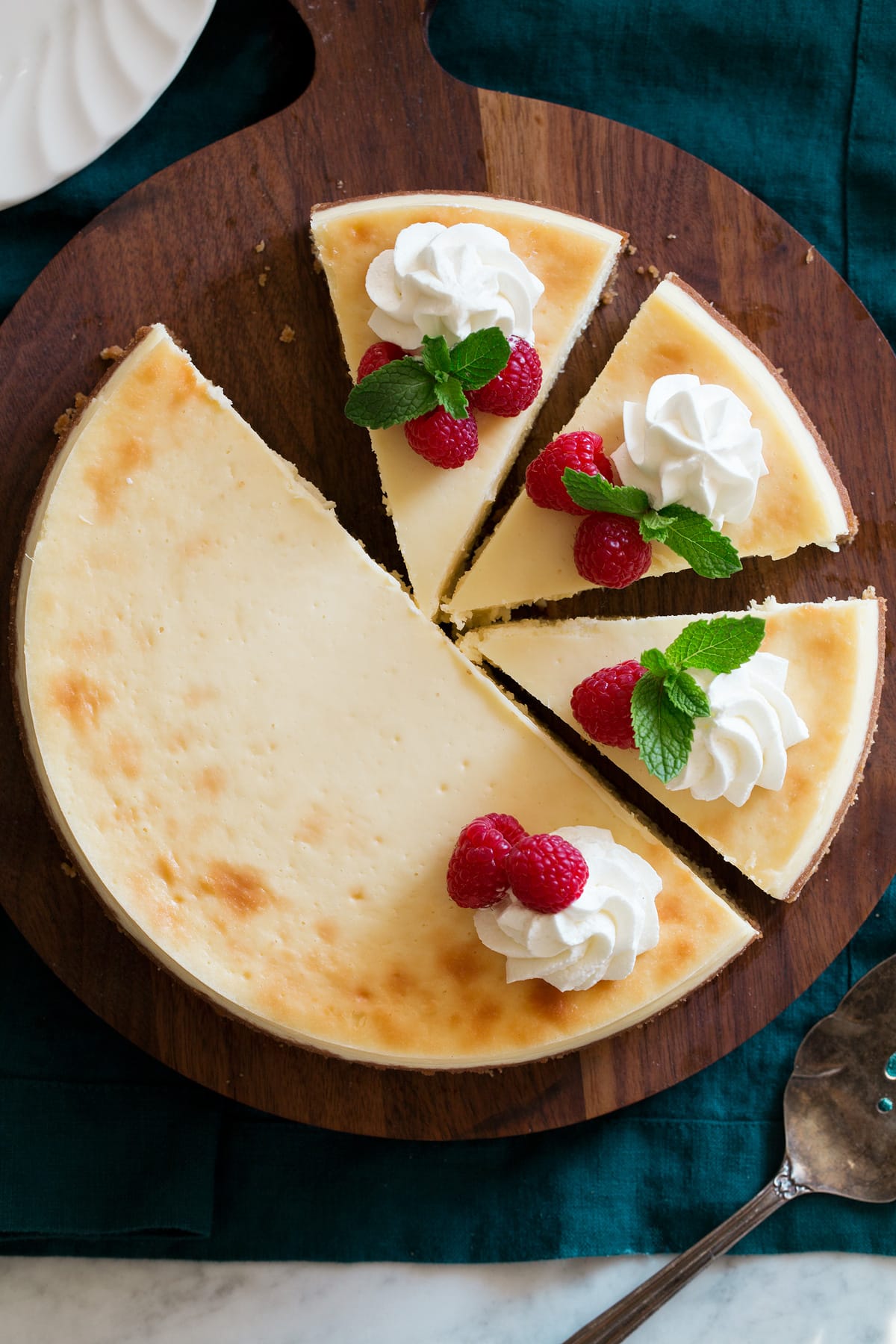 Overhead image of sliced cheesecake.