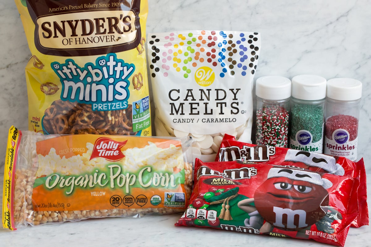 Ingredients to make easy christmas crunch popcorn treat.