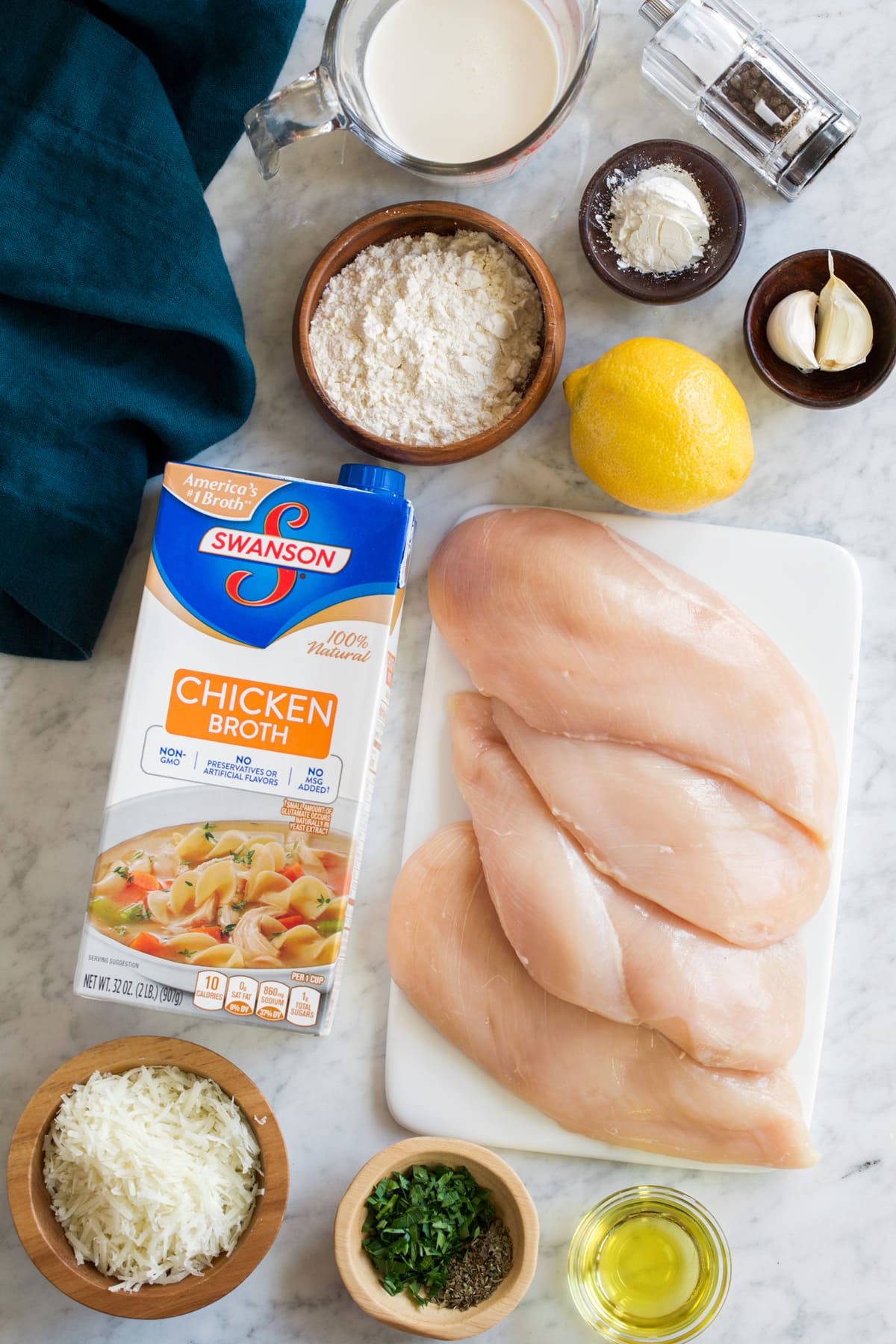 Ingredients needed to make creamy lemon romano chicken shown here.