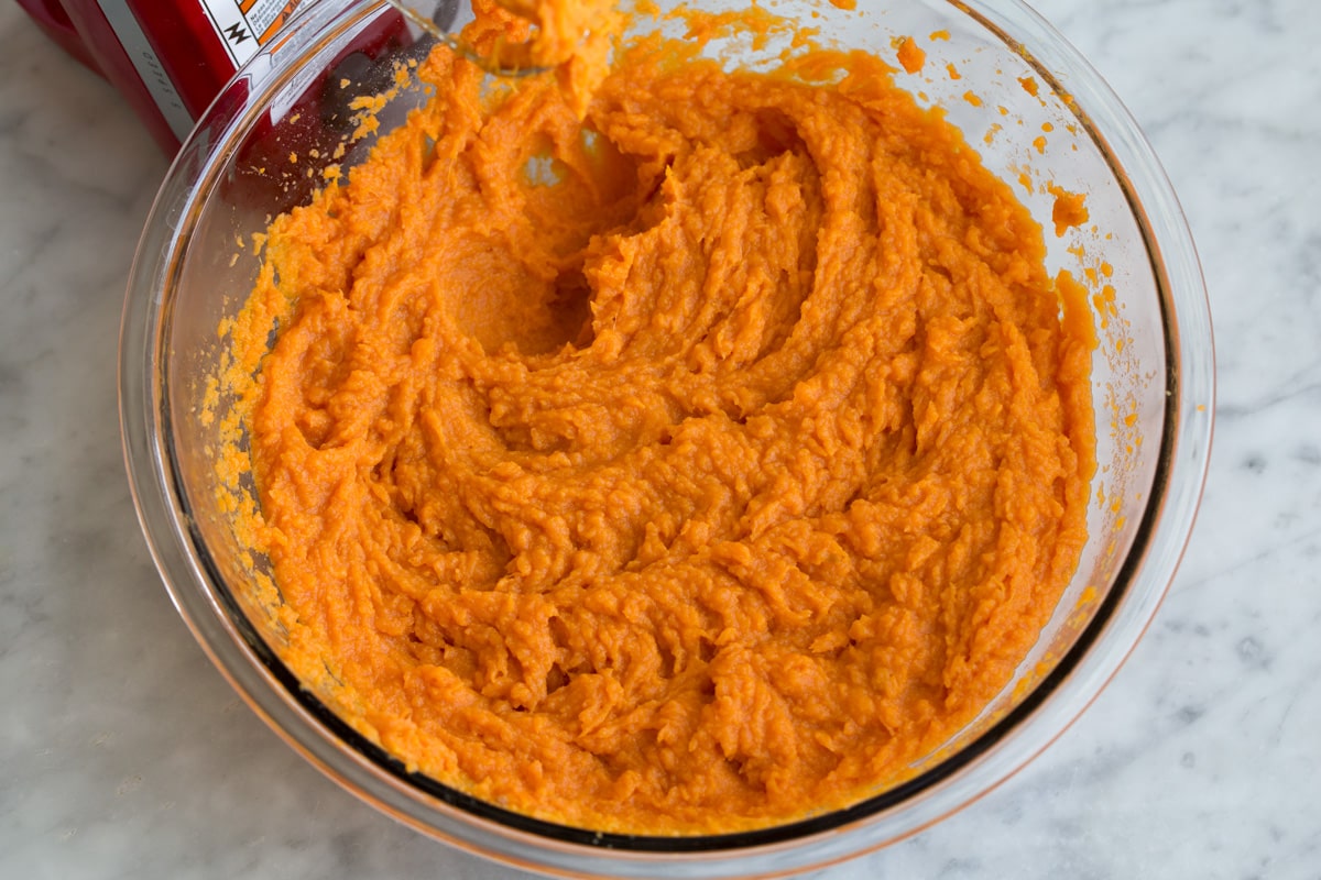 Mashed Sweet Potatoes - one of the best fall side dishes! These really are the best mashed sweet potatoes the secret ingredient is the browned butter! #mashedpotatoes #sweetpotatoes #sidedish #thanksigving Mashed sweet potatoes shown after blending with an electric mixer.
