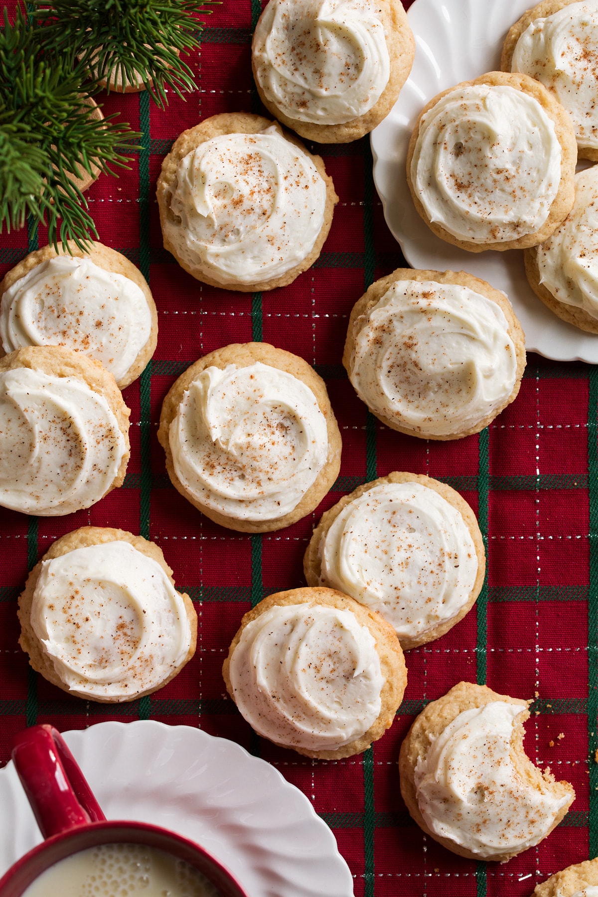 Eggnog Cookies sitting on a Christmas plaid tablecloth.