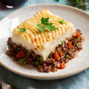 Cut serving of shepherd's pie on a serving plate.