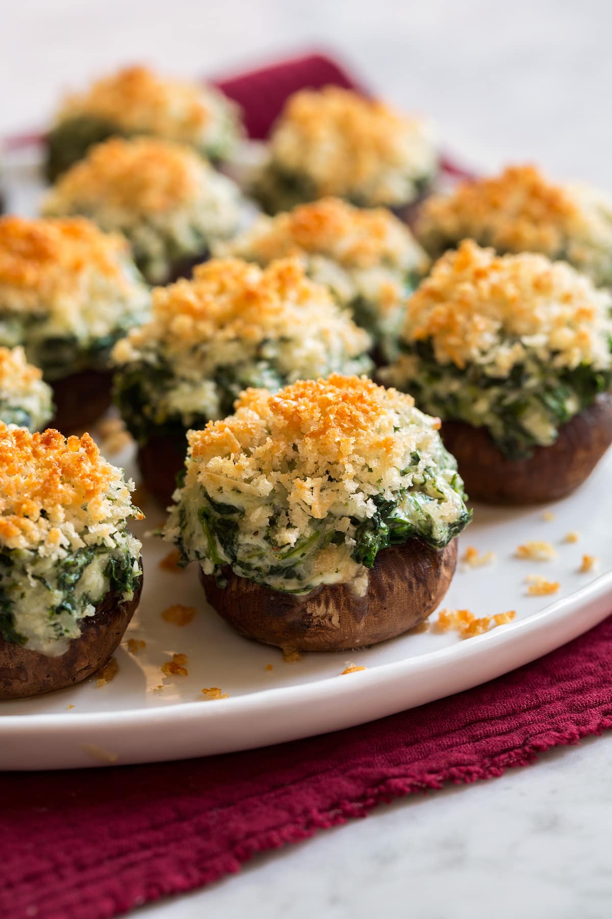 Stuffed Mushrooms Stuffed Mushrooms sitting on a white platter.