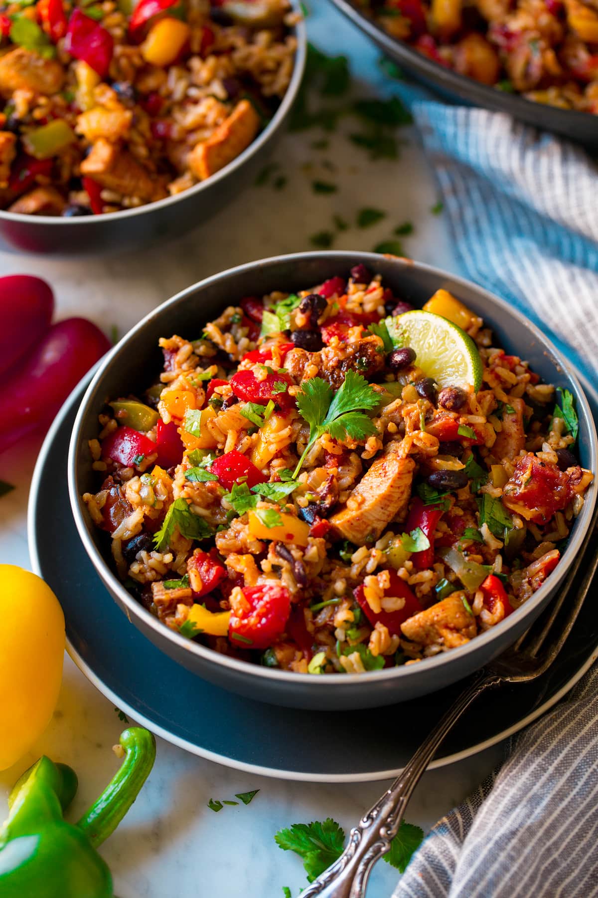 Chicken Fajita Rice Bowl shown as two servings in dark blue bowls.