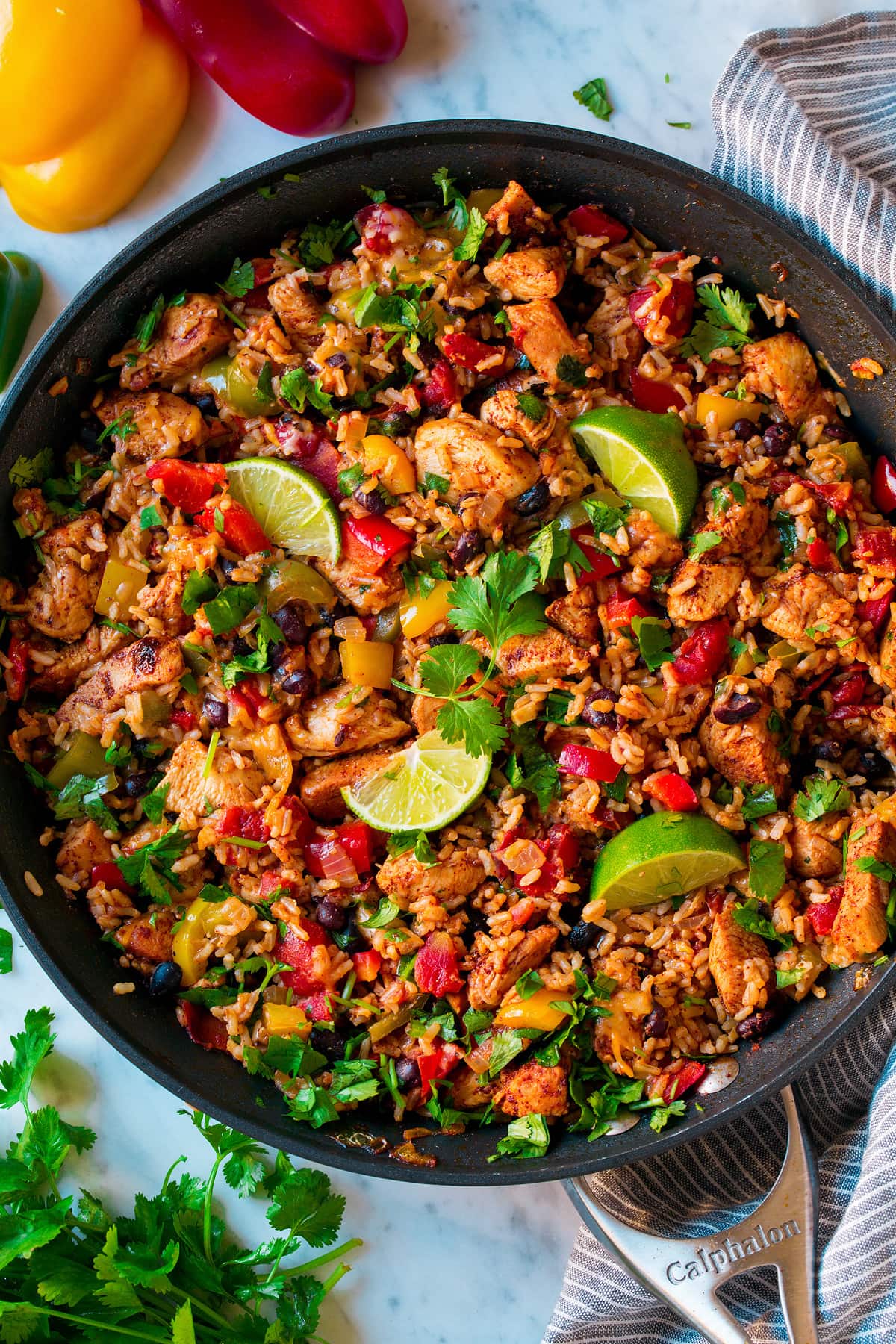 Chicken Fajita Rice Bowl shown after cooking in one pan. It includes brown rice, chicken, black beans and bell peppers.