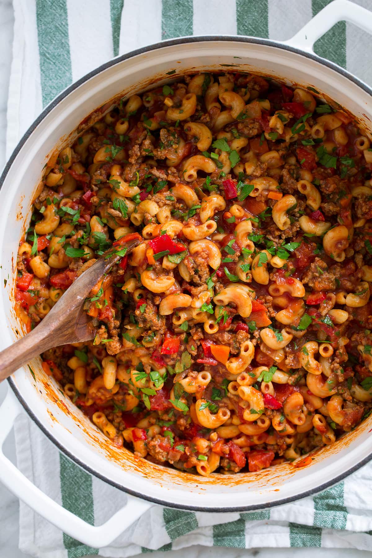 Overhead image of beef goulash in a large pot.