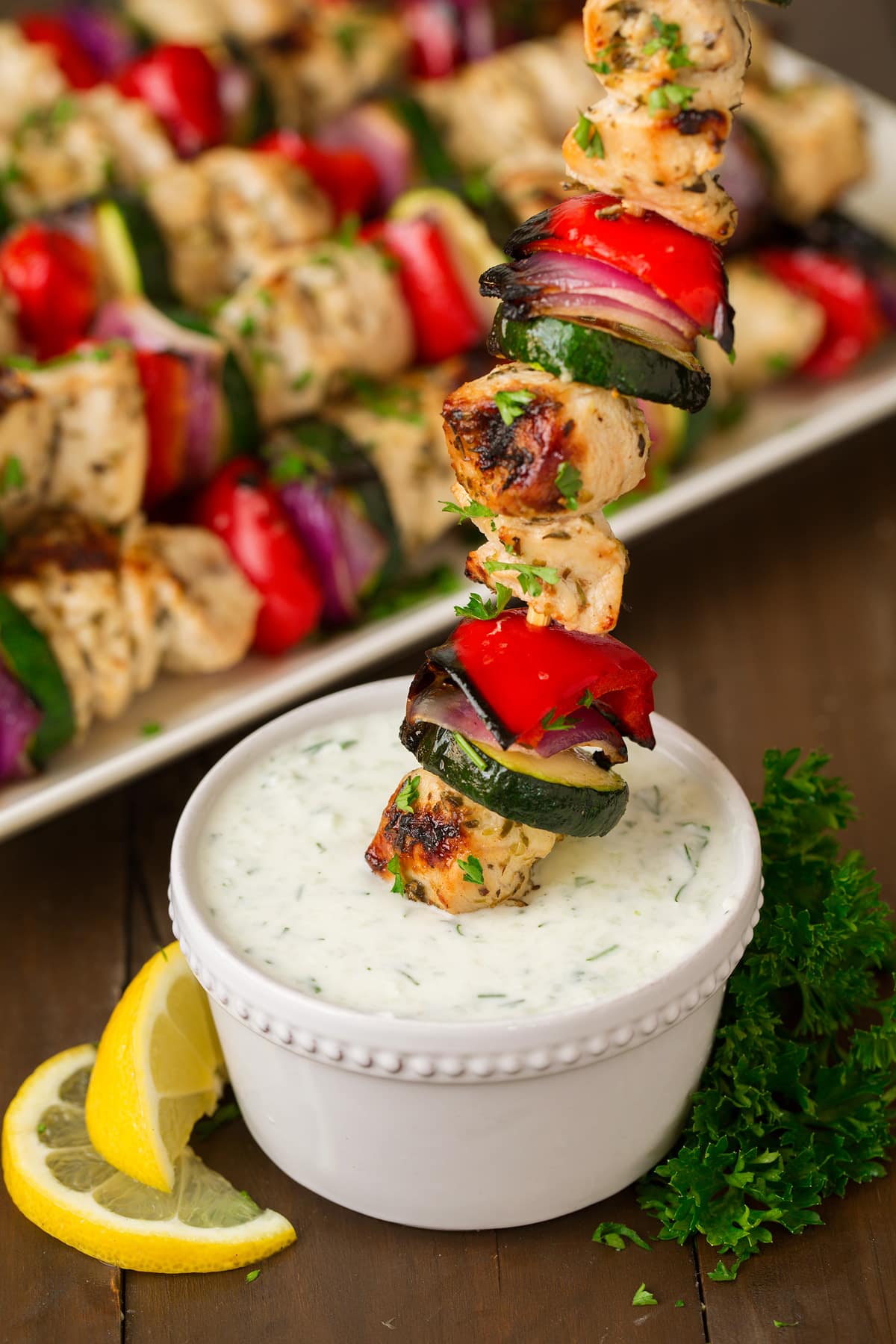 Greek Chicken Kebabs dipped in tzatziki sauce