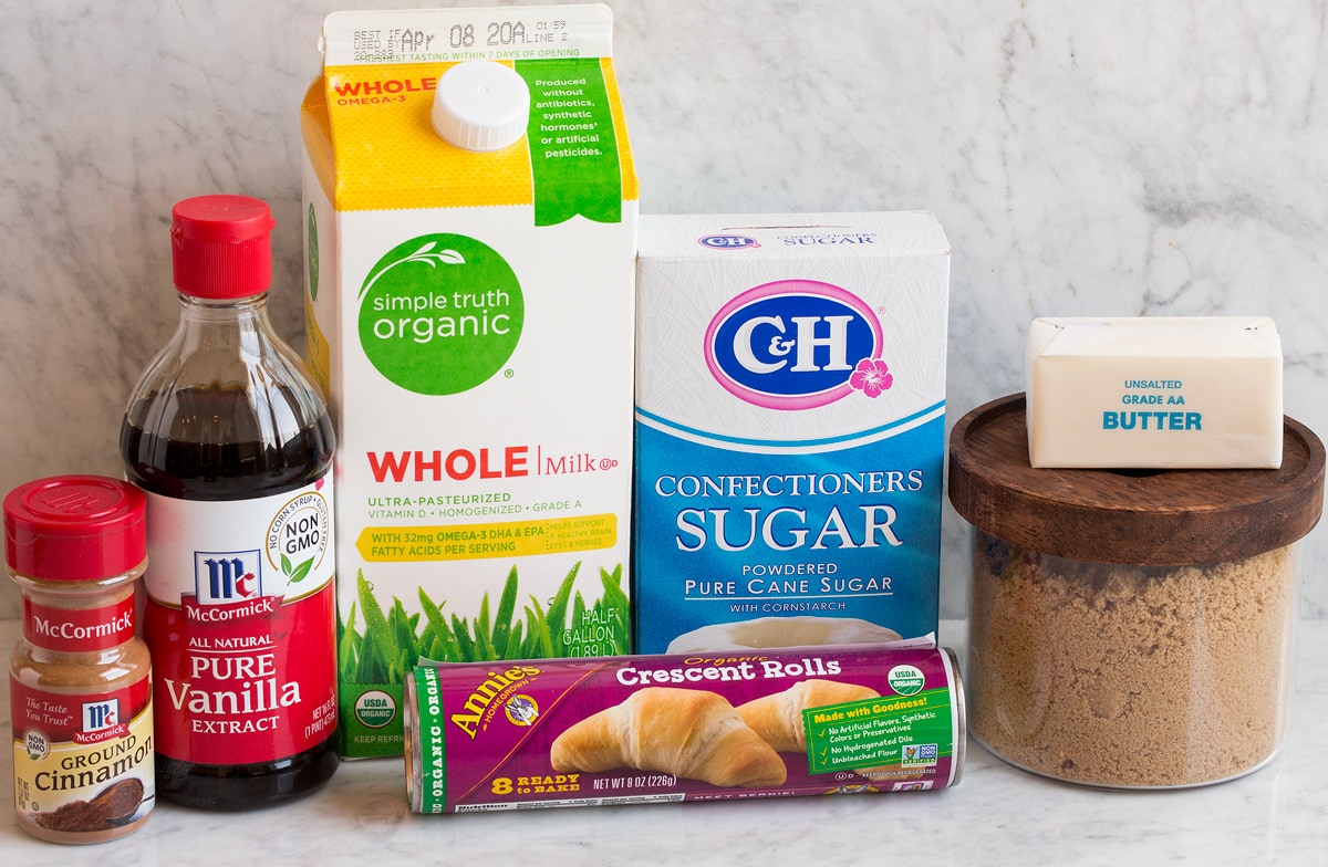 Easy Mini Cinnamon Rolls Photo of ingredients used to make mini cinnamon rolls. Includes crescent dough, brown sugar, butter, powdered sugar, milk, vanilla and cinnamon.