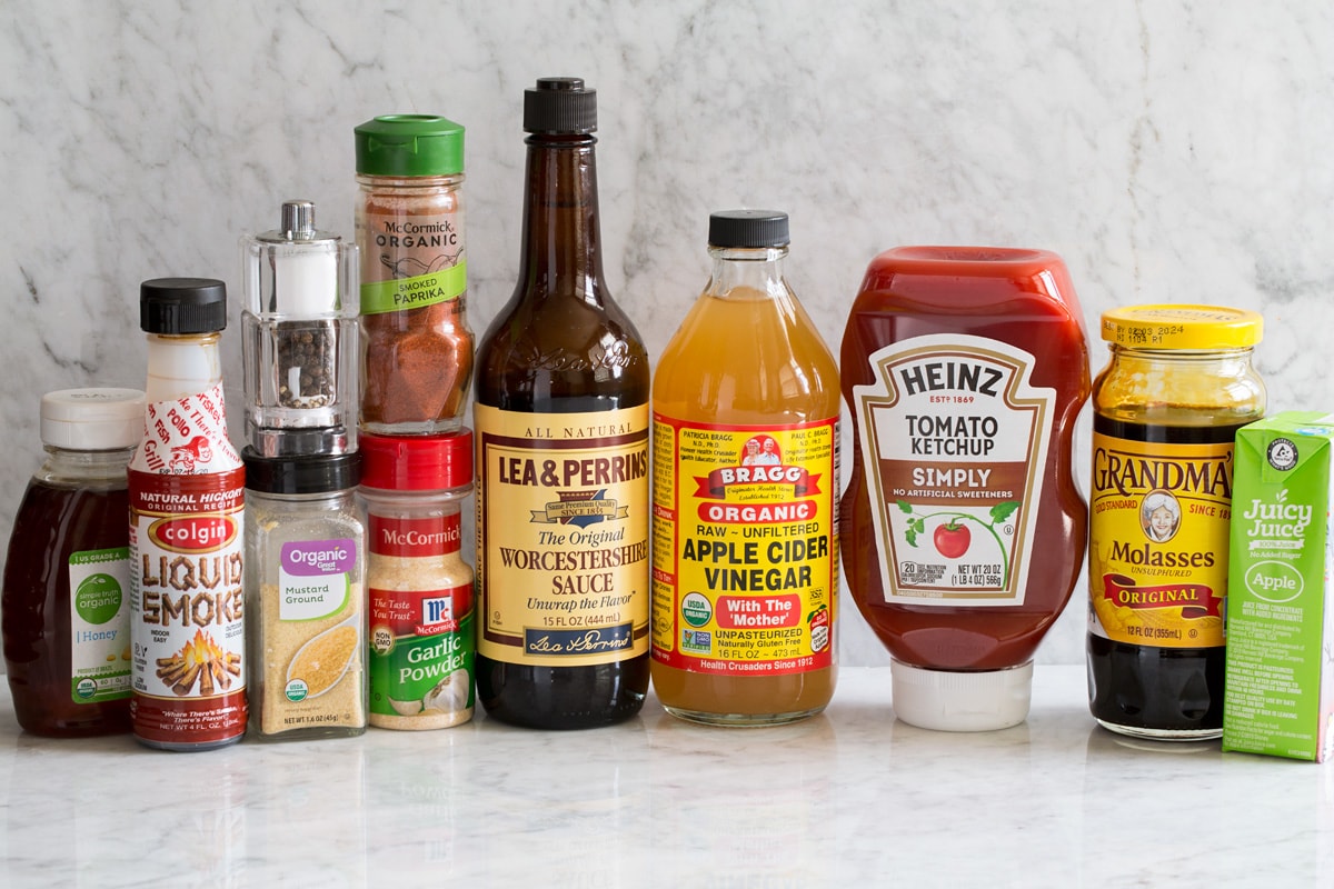 Homemade BBQ Sauce Image of ingredients used to make homemade bbq sauce shown. Including honey, liquid smoke flavor, dry mustard, salt and pepper, garlic powder, smoked paprika, Worcestershire, apple cider vinegar, ketchup, molasses and apple juice.