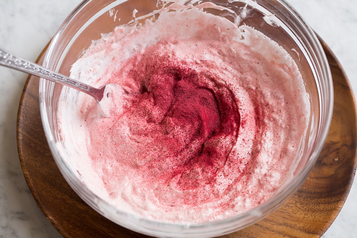 Easy Cream Cheese Fruit Dip Fruit dip shown during mixing with a fork.