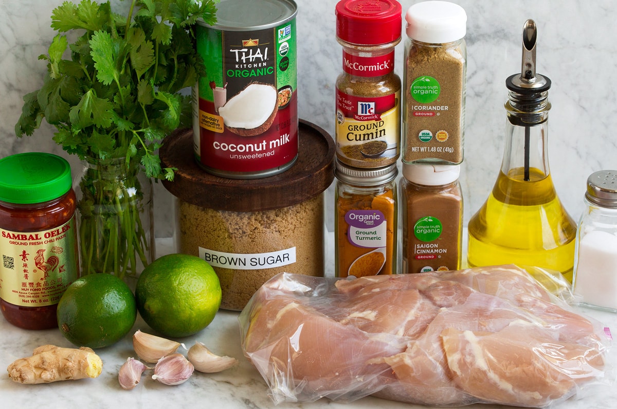 Image of marinade ingredients and chicken for Thai coconut grilled chicken thighs.