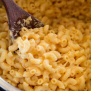 Close up image of mac and cheese being scooped from Instant Pot.